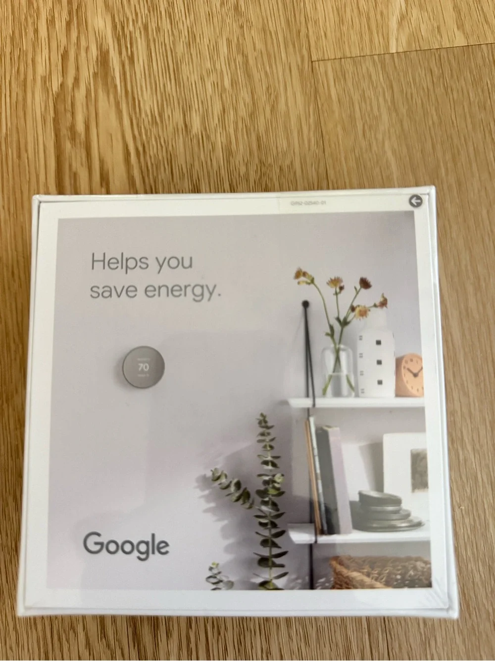 google Nest Thermostat - White Packaging with Gray Thermostat Image